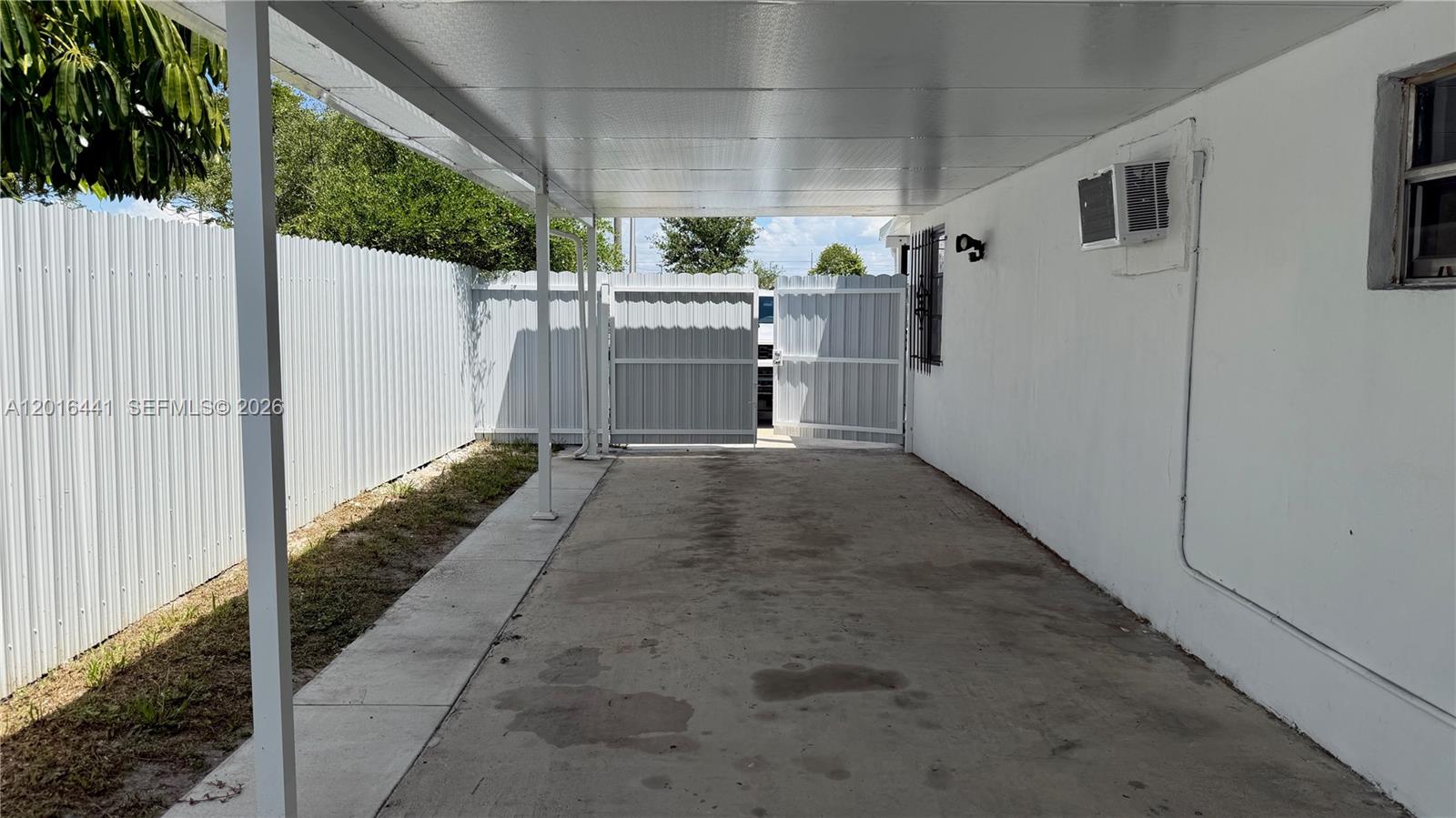 2230 Service Road Opa-Locka, FL 33054 - Photo 24 of 25 a view of a house with a backyard