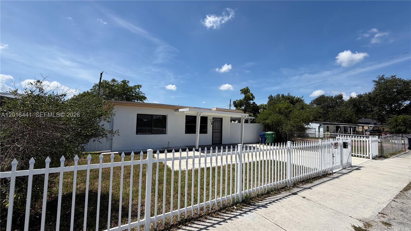 2230 Service Road Opa-Locka, FL 33054 - Photo 3 of 25 a house view with a garden space