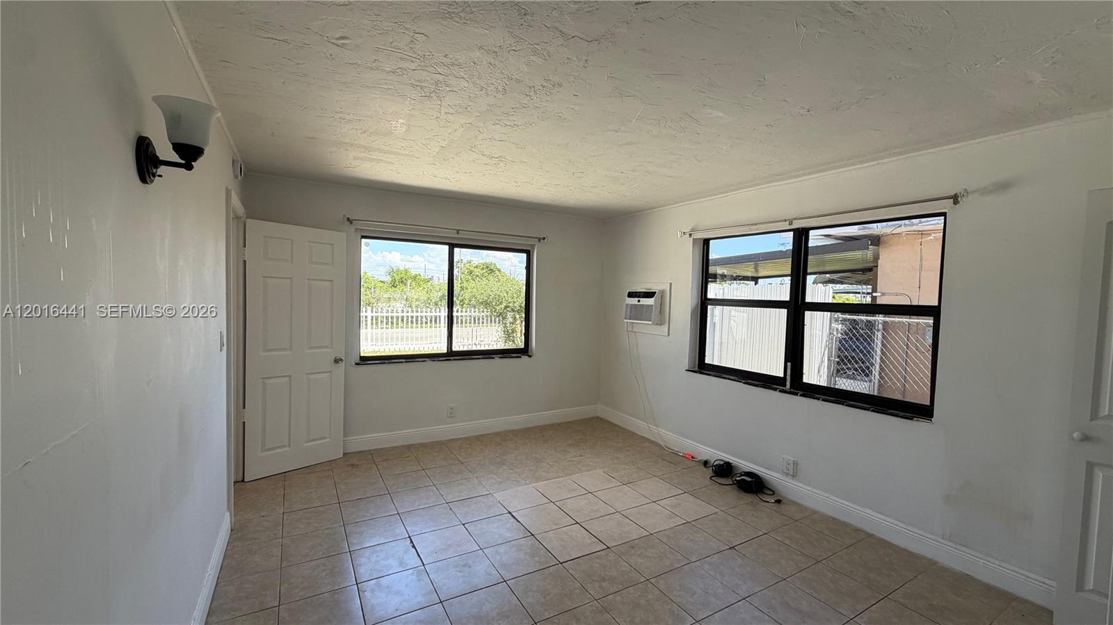 2230 Service Road Opa-Locka, FL 33054 - Photo 8 of 25 a view of an empty room with a window