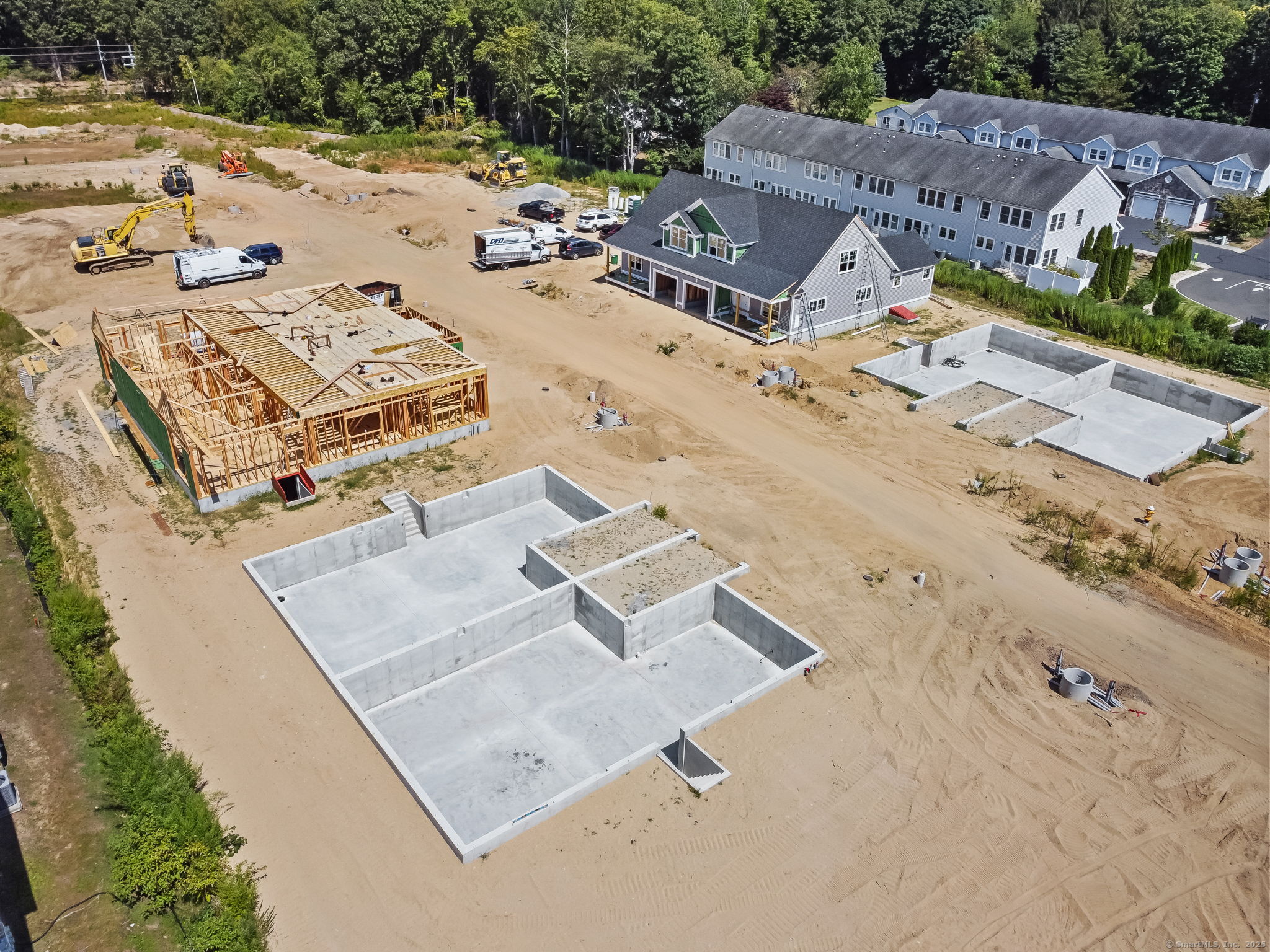 151-153 East Main Street, Unit 8 Clinton, CT 06413 - Photo 22 of 25 an aerial view of a house with a garden
