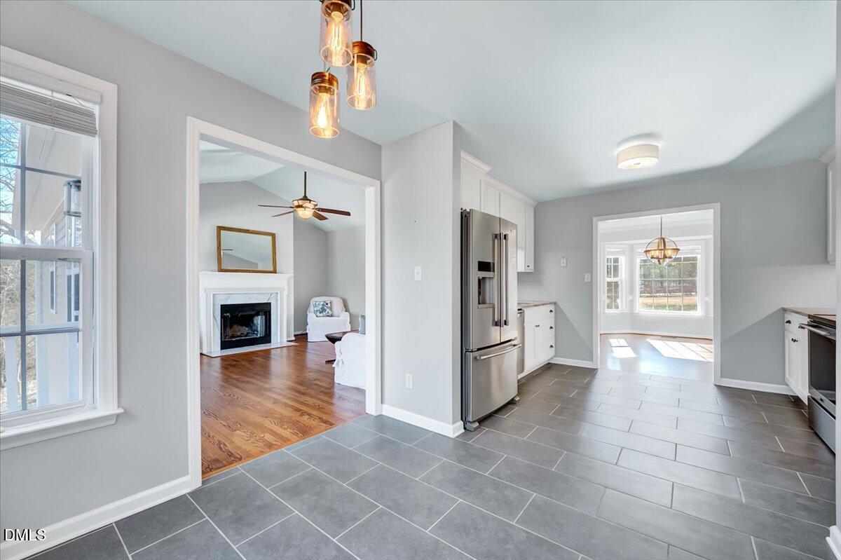 1716 Middle Ridge Drive Willow Spring, NC 27592 - Photo 12 of 41 a view of livingroom with hardwood floor and a kitchen