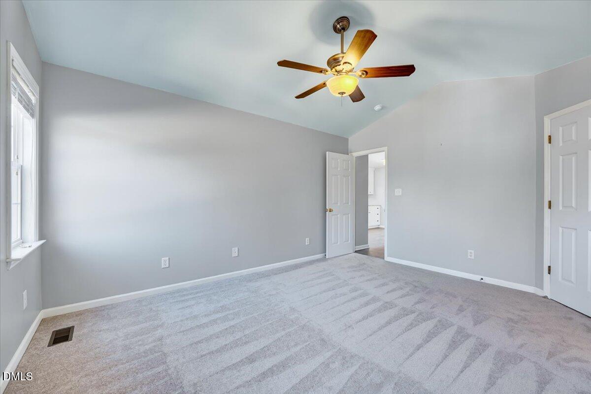 1716 Middle Ridge Drive Willow Spring, NC 27592 - Photo 18 of 41 a view of an empty room with a window