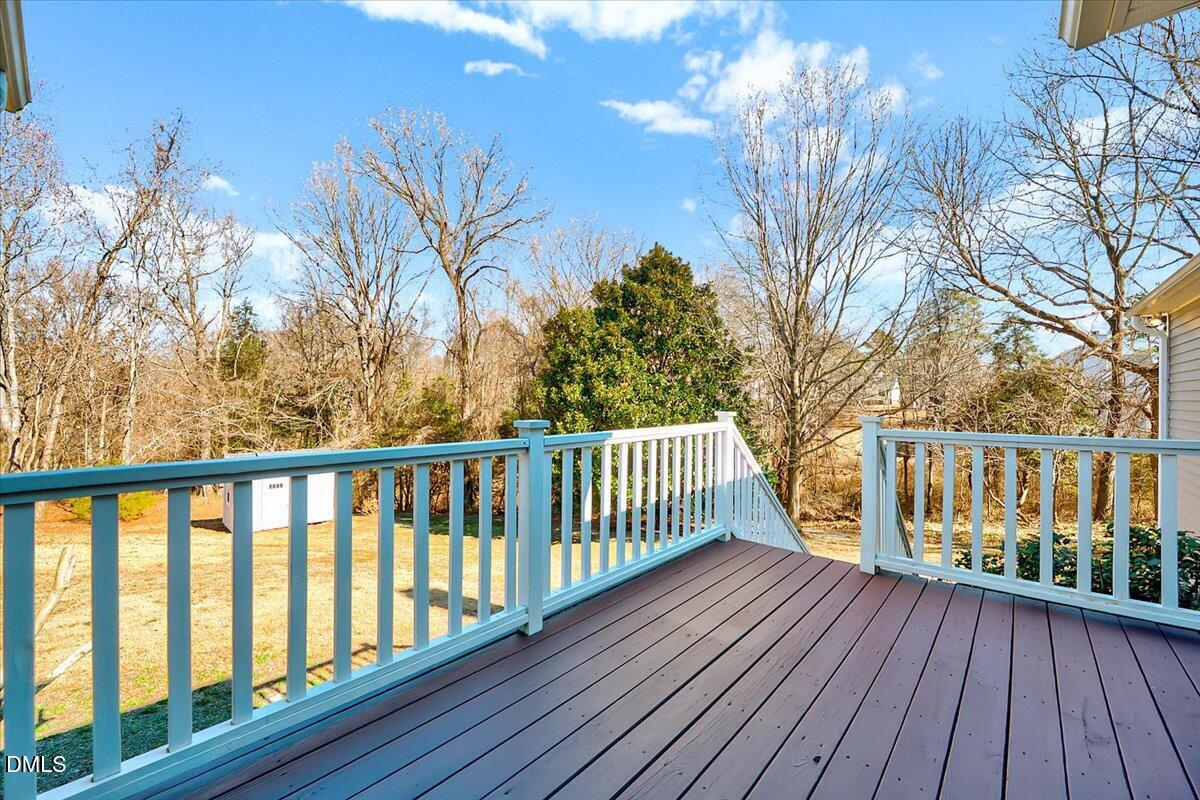 1716 Middle Ridge Drive Willow Spring, NC 27592 - Photo 27 of 41 a view of balcony with wooden floor and fence