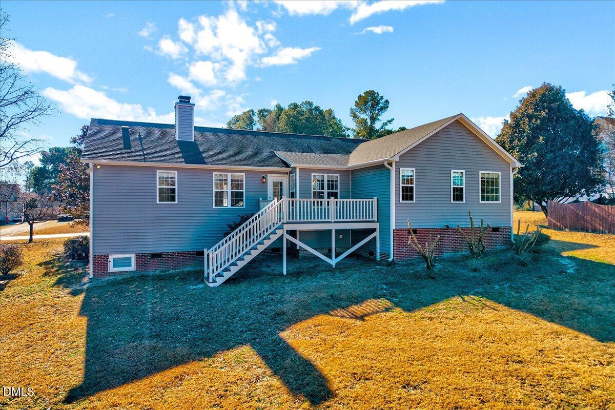 1716 Middle Ridge Drive Willow Spring, NC 27592 - Photo 30 of 41 a view of a house with a yard