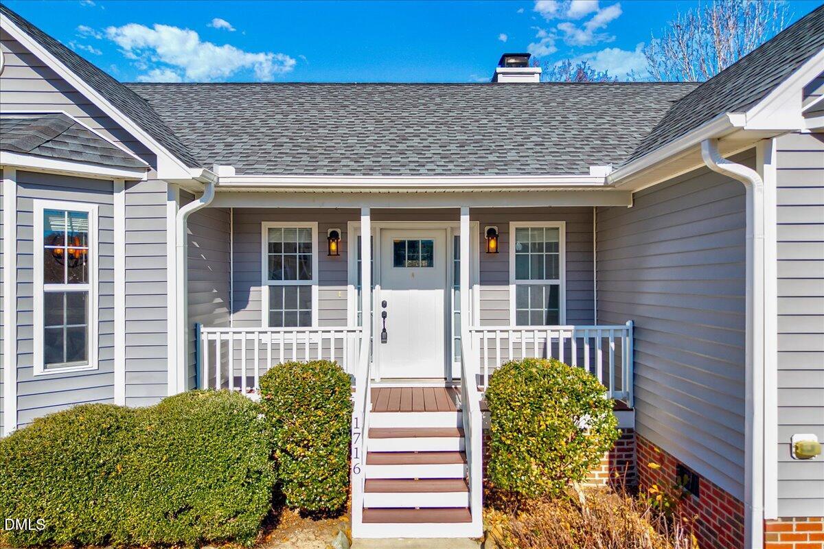 1716 Middle Ridge Drive Willow Spring, NC 27592 - Photo 3 of 41 a front view of a house with a porch