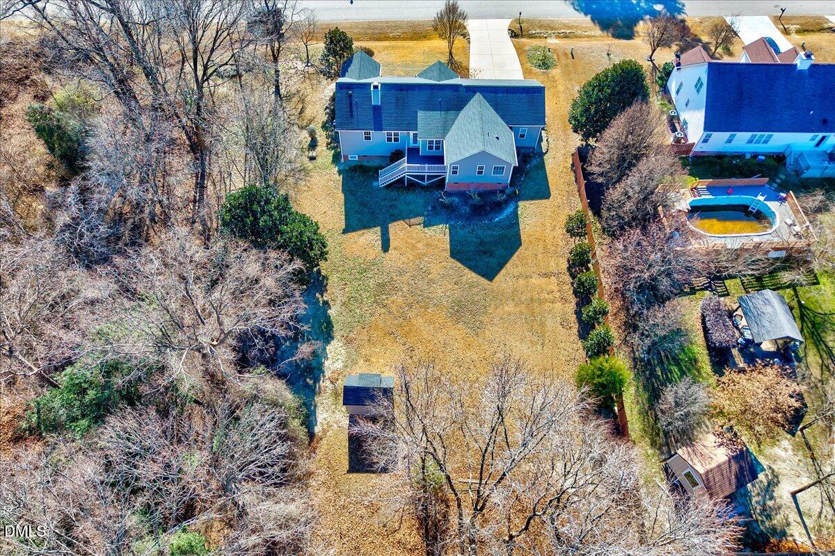 1716 Middle Ridge Drive Willow Spring, NC 27592 - Photo 33 of 41 a aerial view of a house with a yard and trees