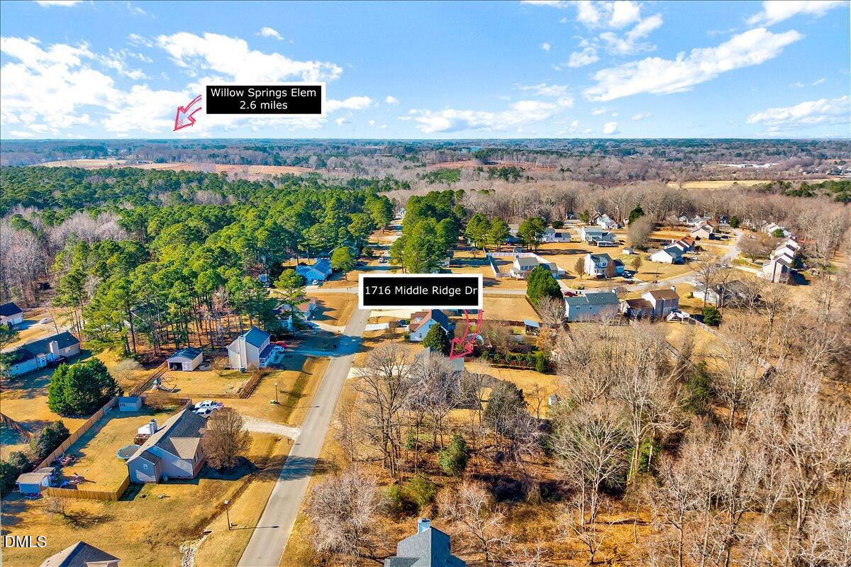 1716 Middle Ridge Drive Willow Spring, NC 27592 - Photo 39 of 41 an aerial view of a house with a yard