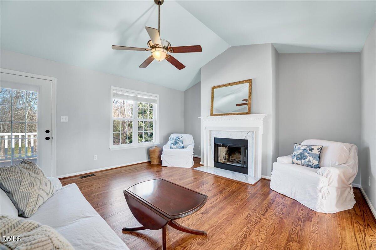 1716 Middle Ridge Drive Willow Spring, NC 27592 - Photo 5 of 41 a living room with furniture and a fireplace