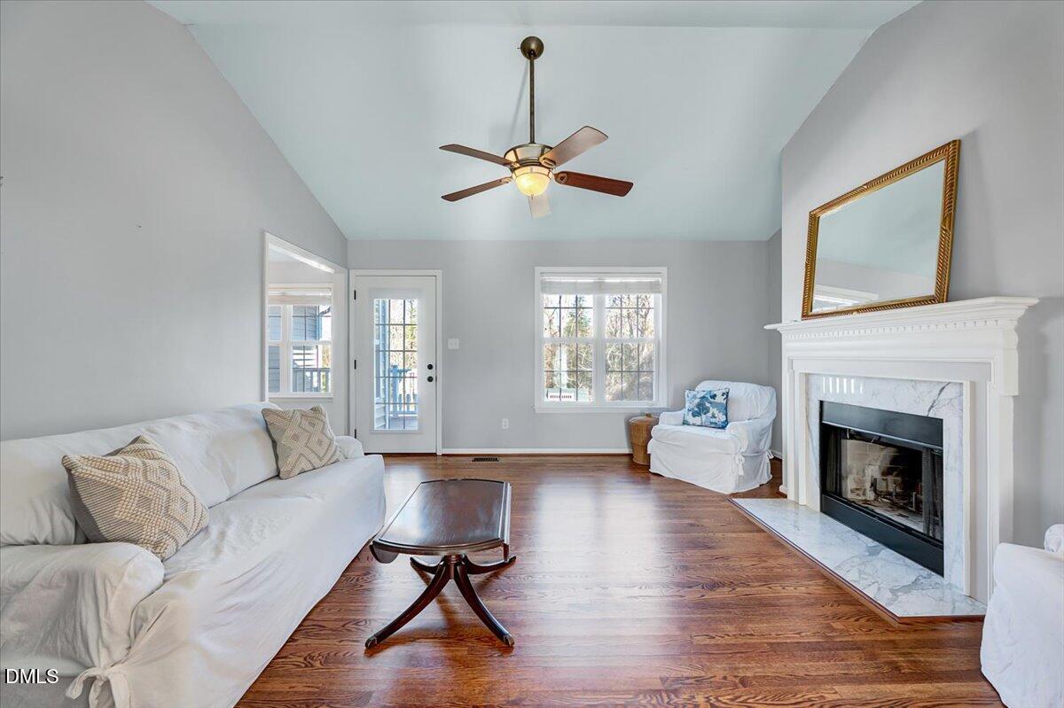1716 Middle Ridge Drive Willow Spring, NC 27592 - Photo 6 of 41 a living room with furniture and a fireplace