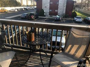 263 River Avenue, Unit 6AU Patchogue, NY 11772 - Photo 12 of 12 a view of a balcony with chairs