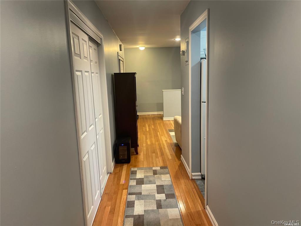 263 River Avenue, Unit 6AU Patchogue, NY 11772 - Photo 8 of 12 a bathroom with mirror and shower