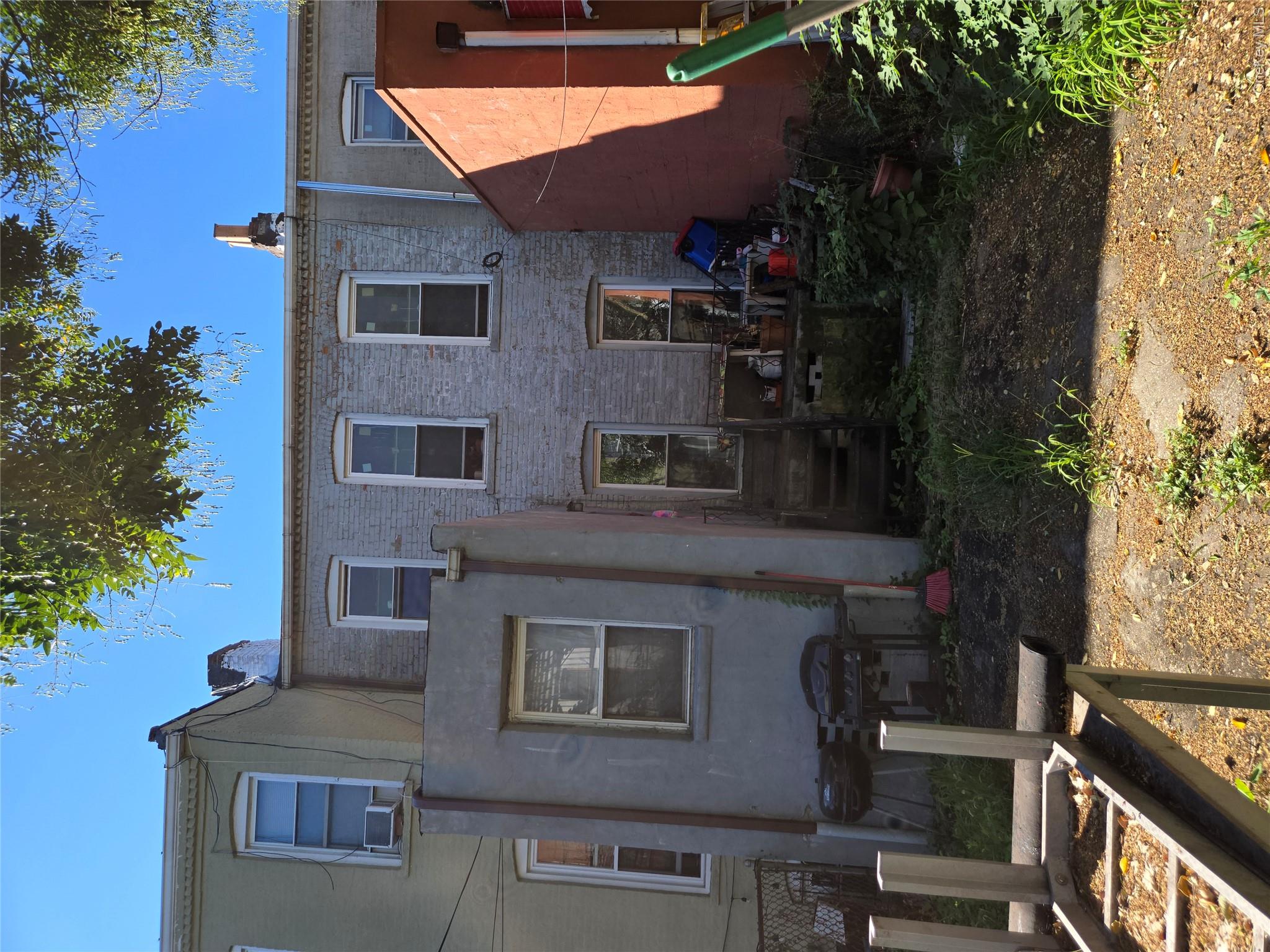 343 Rutland Road Brooklyn, NY 11225 - Photo 17 of 17 Back of house featuring brick siding