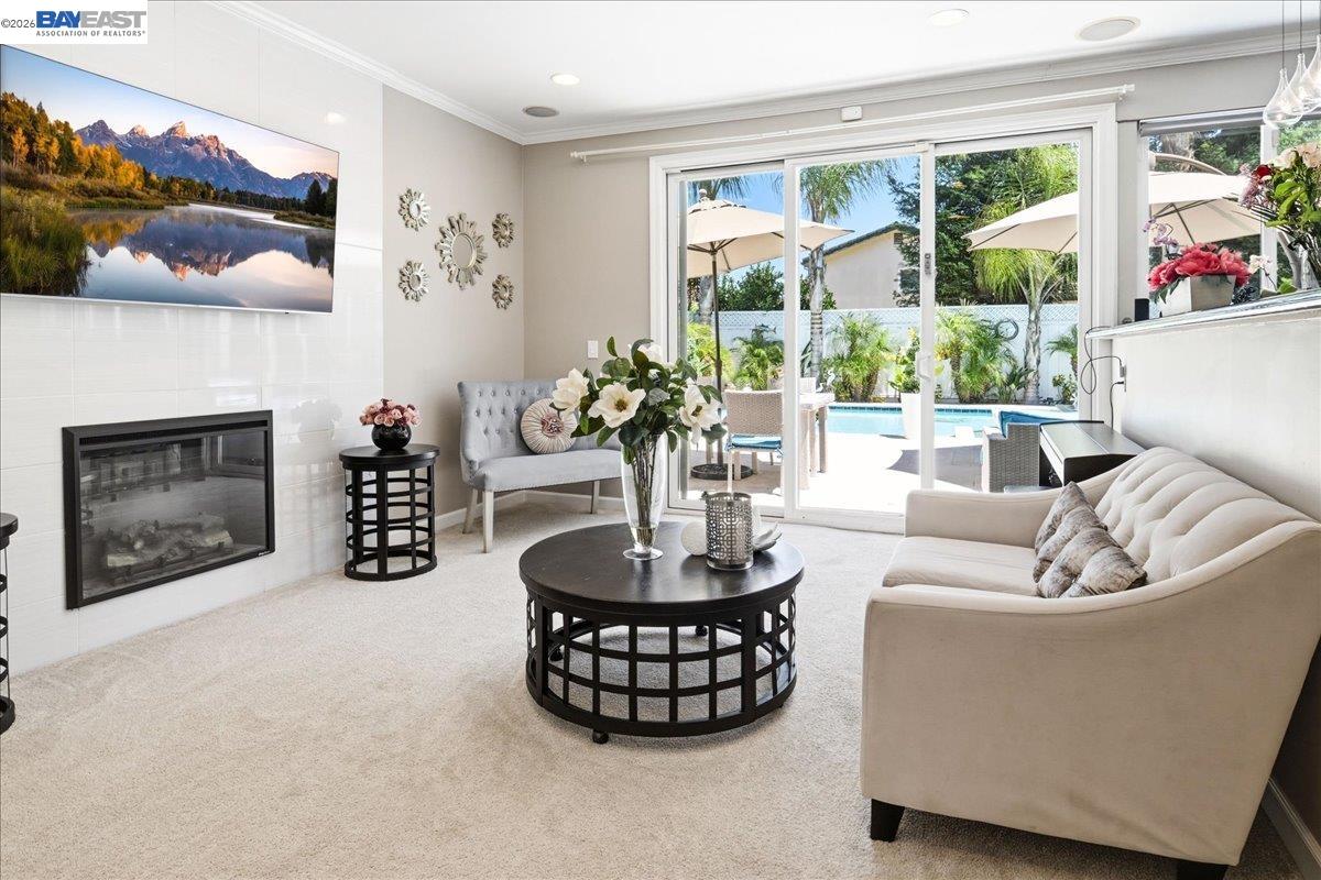 2861 Millbridge Place San Ramon, CA 94583 - Photo 20 of 58 a living room with furniture a fireplace and a large window