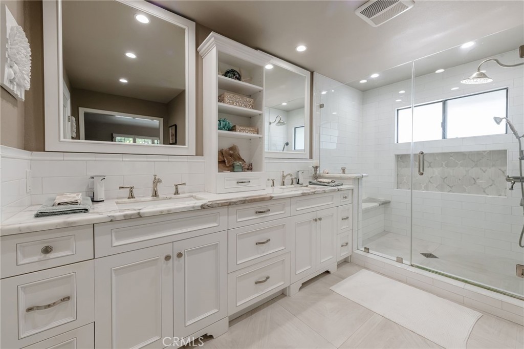 1 Santa Rosa Court Manhattan Beach, CA 90266 - Photo 16 of 28 a bathroom with double sink and a mirror