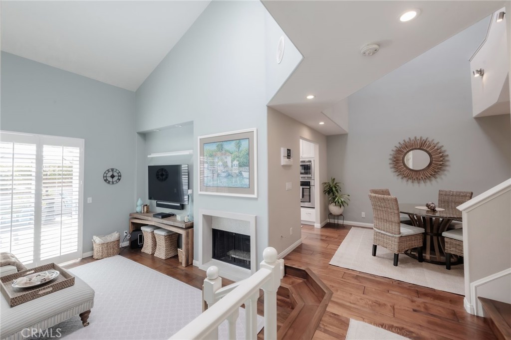 1 Santa Rosa Court Manhattan Beach, CA 90266 - Photo 2 of 28 a living room with furniture a fireplace and a flat screen tv