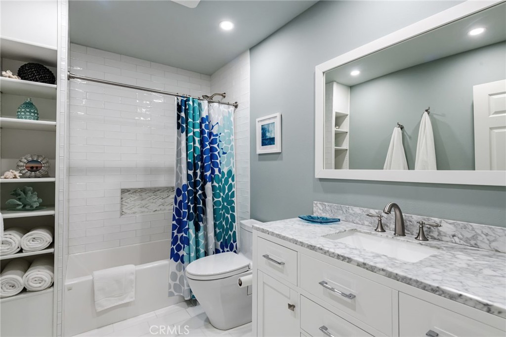 1 Santa Rosa Court Manhattan Beach, CA 90266 - Photo 21 of 28 a bathroom with a granite countertop sink toilet and shower