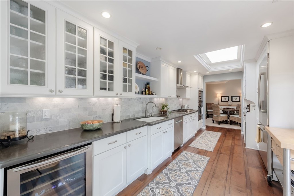 1 Santa Rosa Court Manhattan Beach, CA 90266 - Photo 5 of 28 a kitchen with a sink and cabinets