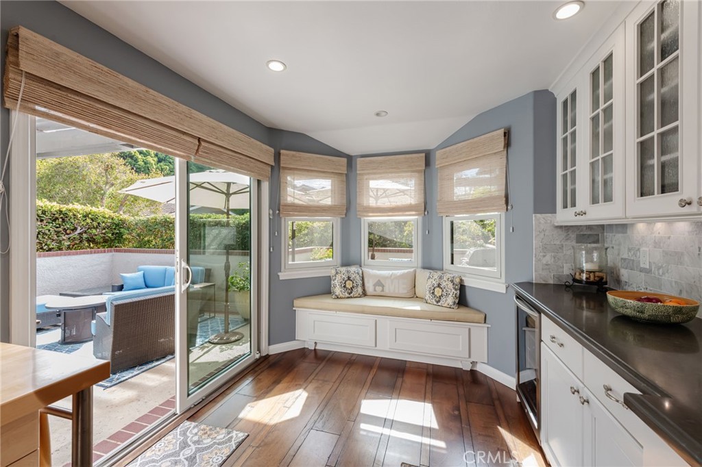 1 Santa Rosa Court Manhattan Beach, CA 90266 - Photo 6 of 28 a living room with furniture and a floor to ceiling window