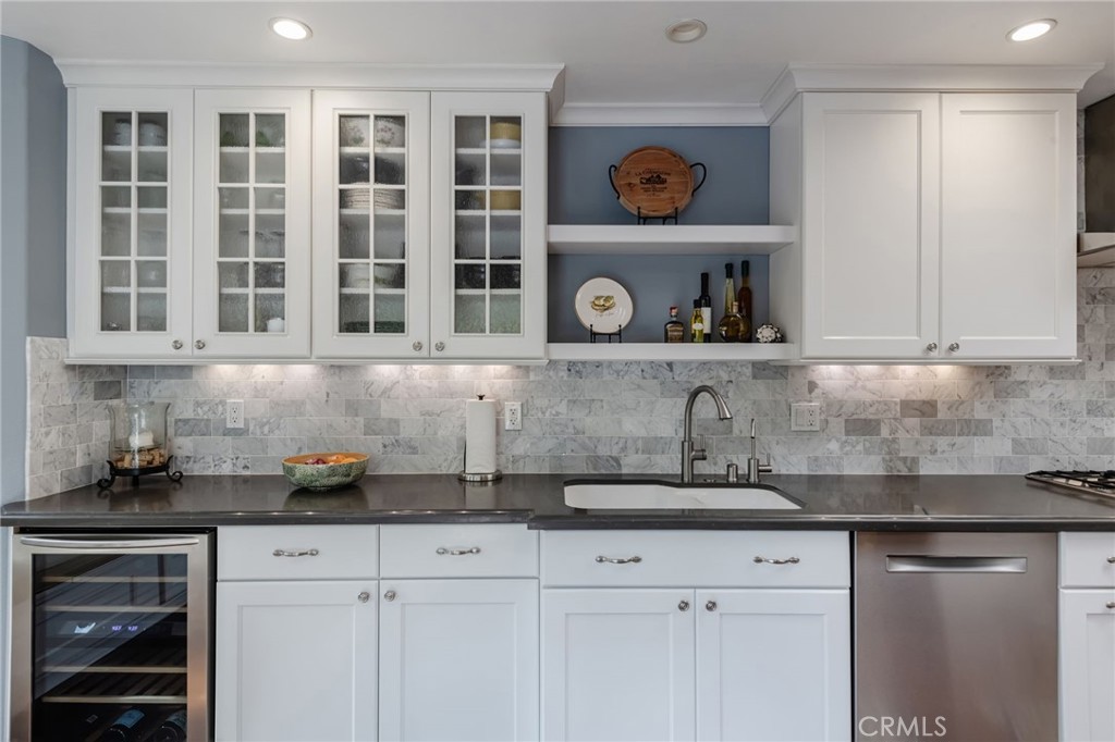 1 Santa Rosa Court Manhattan Beach, CA 90266 - Photo 7 of 28 a kitchen with stainless steel appliances granite countertop a sink and cabinets