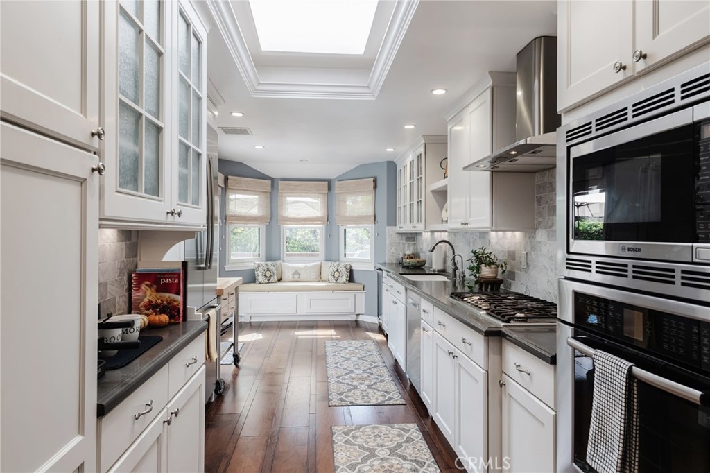 1 Santa Rosa Court Manhattan Beach, CA 90266 - Photo 10 of 28 a kitchen with stainless steel appliances a stove a sink and cabinets