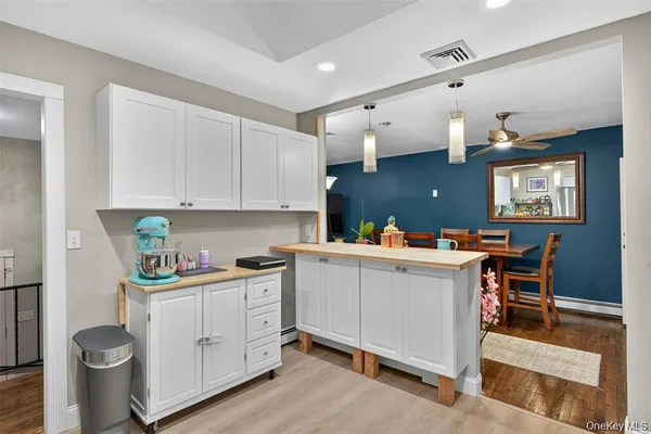 a room with cabinets and wooden floor