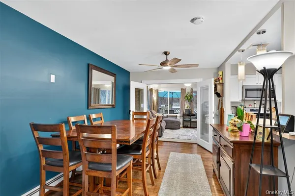 a dining room with furniture and window