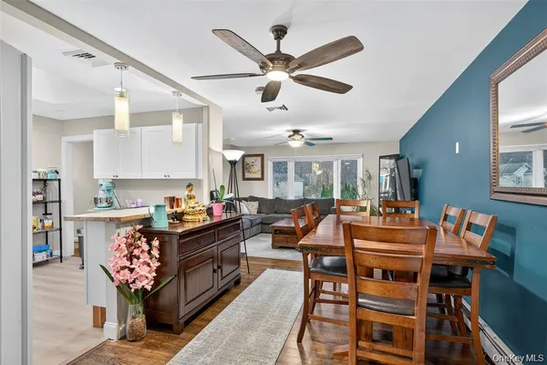 a kitchen with a table and chairs