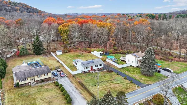 a view of a backyard with swimming pool