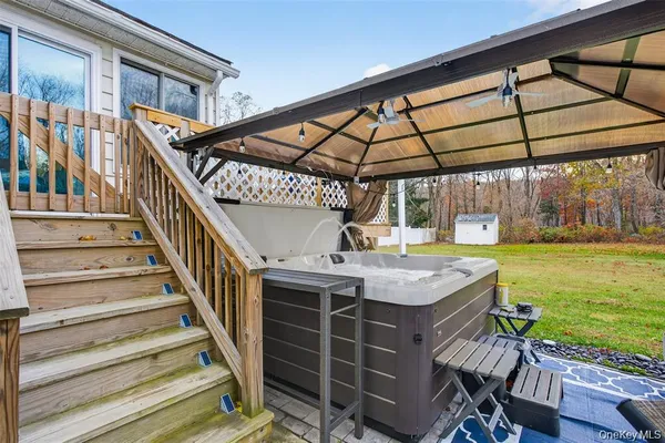 a view of a backyard with sitting area