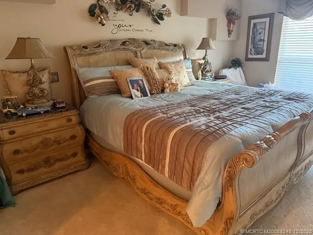 a bedroom with a bed and window