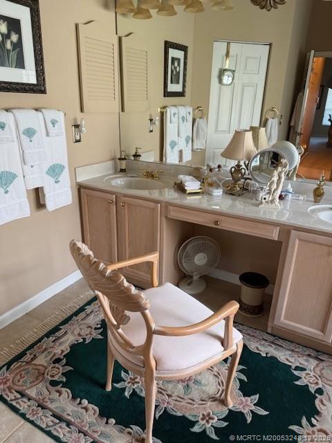 6948 Southeast Twin Oaks Circle Stuart, FL 34997 - Photo 12 of 24 a bathroom with a sink and a mirror