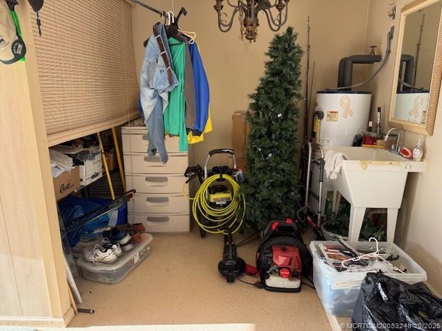 6948 Southeast Twin Oaks Circle Stuart, FL 34997 - Photo 19 of 24 a utility room with dryer and washer