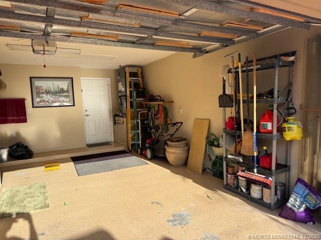 6948 Southeast Twin Oaks Circle Stuart, FL 34997 - Photo 20 of 24 a bed room with a bed and gym equipment