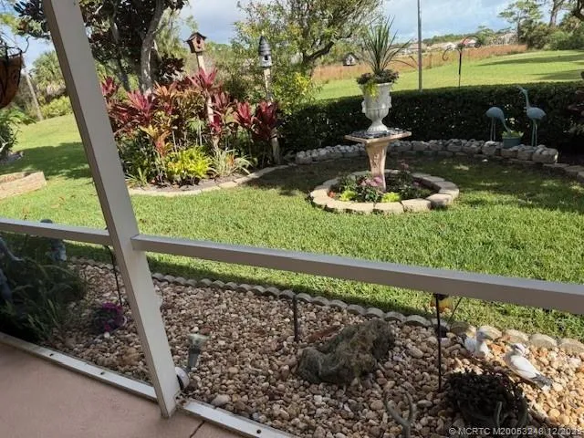a view of a back yard from a balcony