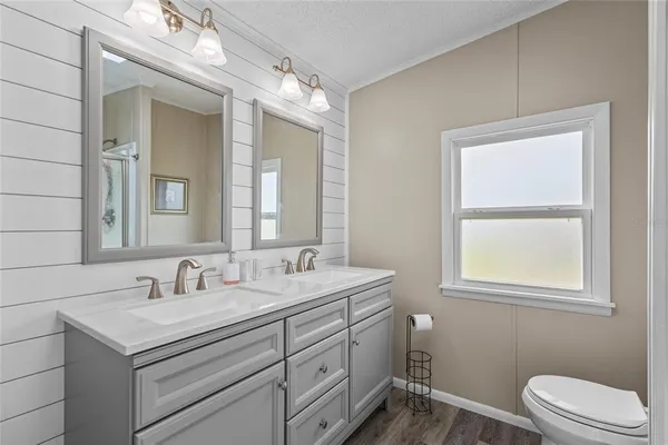 a bathroom with a glass shower door