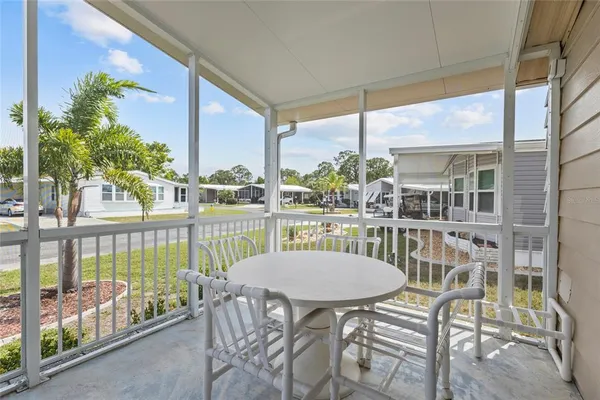 a view of a balcony with chairs