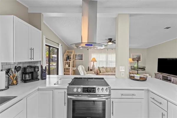 a view of a dining room with furniture wooden floor and a chandelier