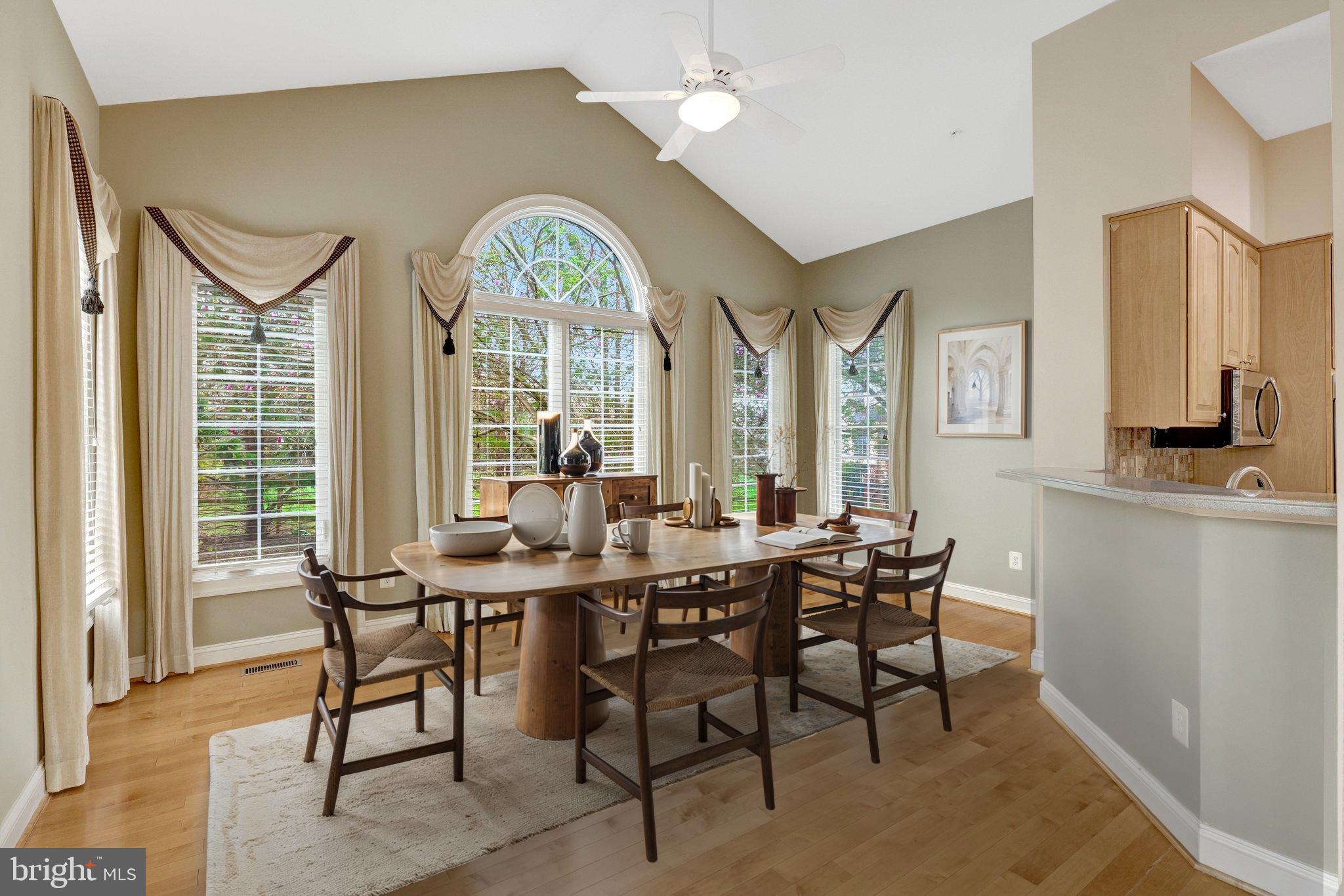 20443 Cliftons Point Street Sterling, VA 20165 - Photo 26 of 37 a view of a dining room with furniture and a large window