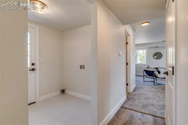 a view of room with furniture and a window