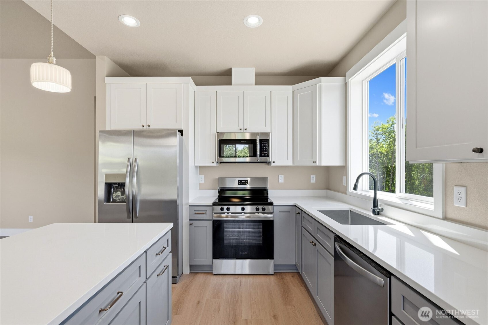 254 Windy Ridge Drive Longview, WA 98632 - Photo 12 of 27 a kitchen with a sink a counter top space stainless steel appliances and a window