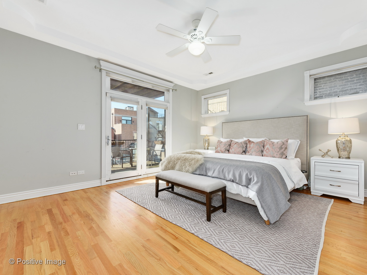1908 North Sheffield Avenue, Unit 2 Chicago, IL 60614 - Photo 12 of 17 a spacious bedroom with a large bed and a chandelier