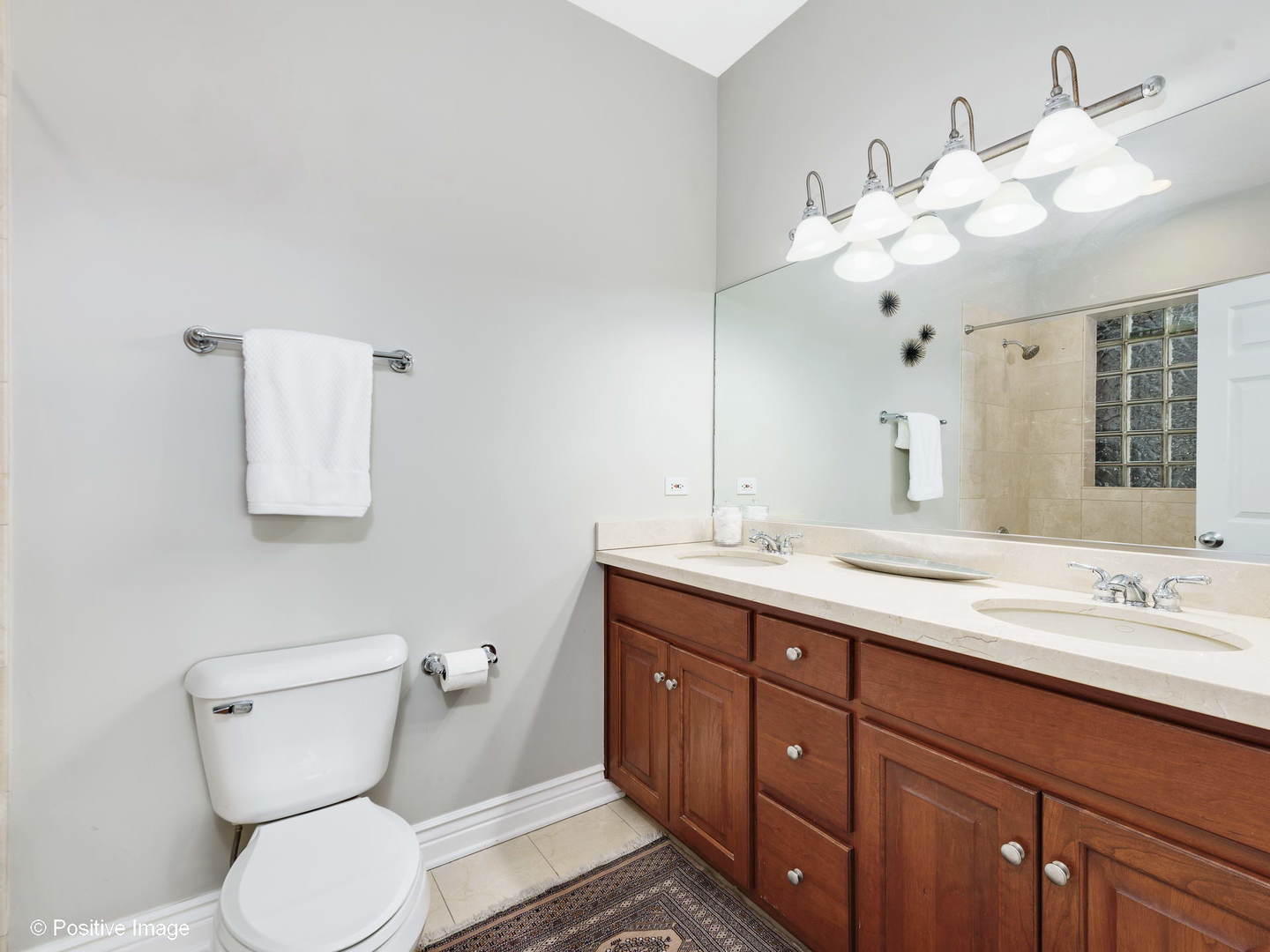 1908 North Sheffield Avenue, Unit 2 Chicago, IL 60614 - Photo 13 of 17 a bathroom with a toilet sink and mirror