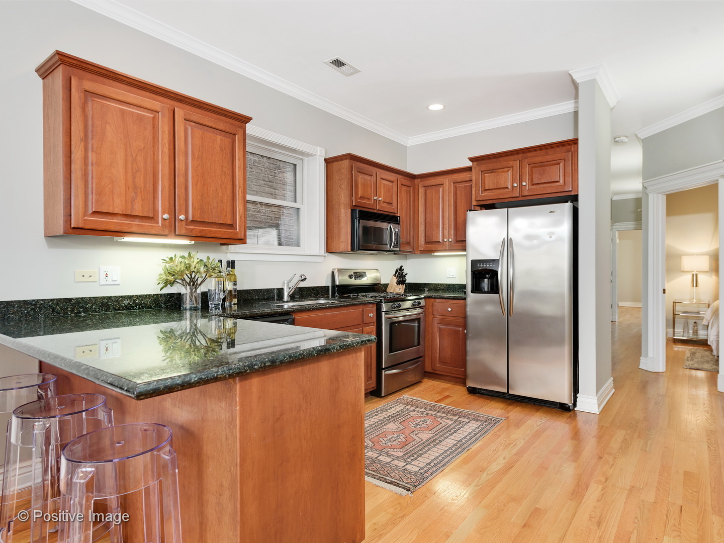 1908 North Sheffield Avenue, Unit 2 Chicago, IL 60614 - Photo 8 of 17 a kitchen with stainless steel appliances granite countertop a refrigerator a stove top oven a sink and dishwasher