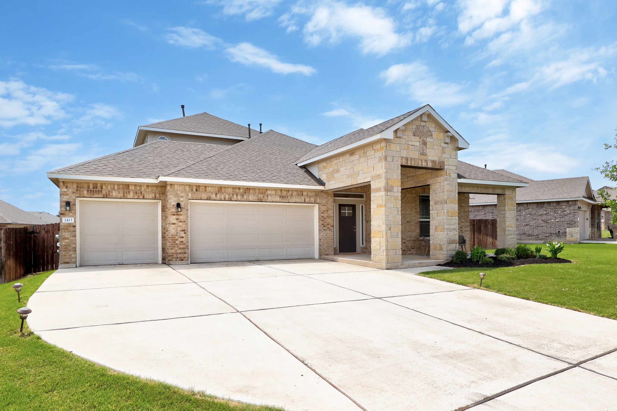 2413 Starhill Ranch Street Georgetown, TX 78628 - Photo 4 of 40 a front view of a house with yard