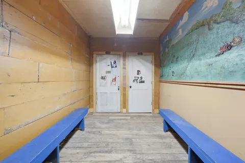 a view of a house with backyard and porch