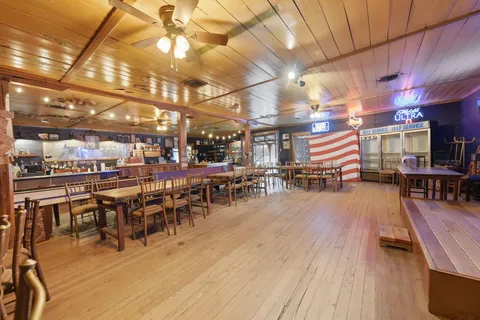 a view of outdoor space with deck and tree
