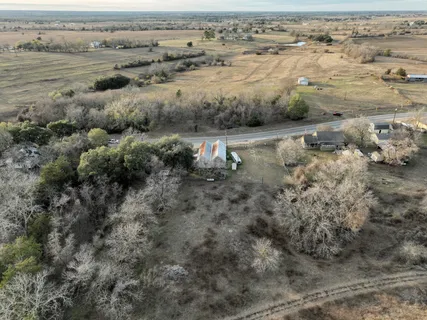 a view of a chairs and table in a patio