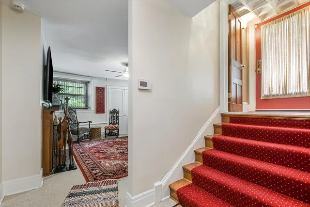a living room with furniture and a rug