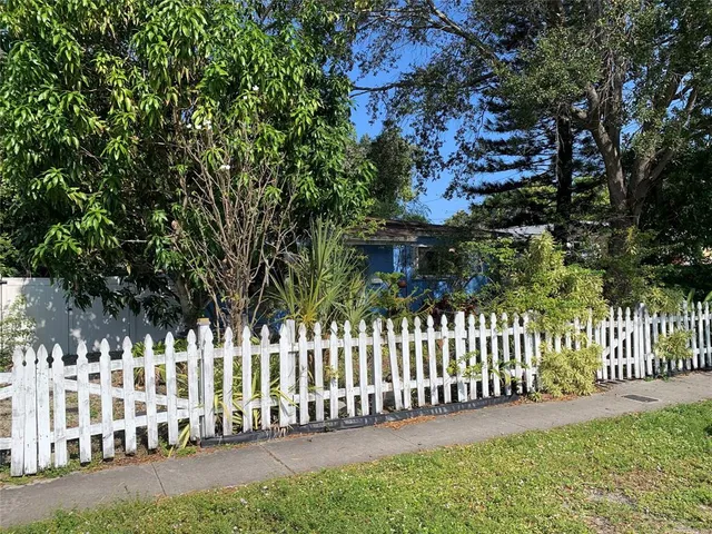 a view of a house with a small yard