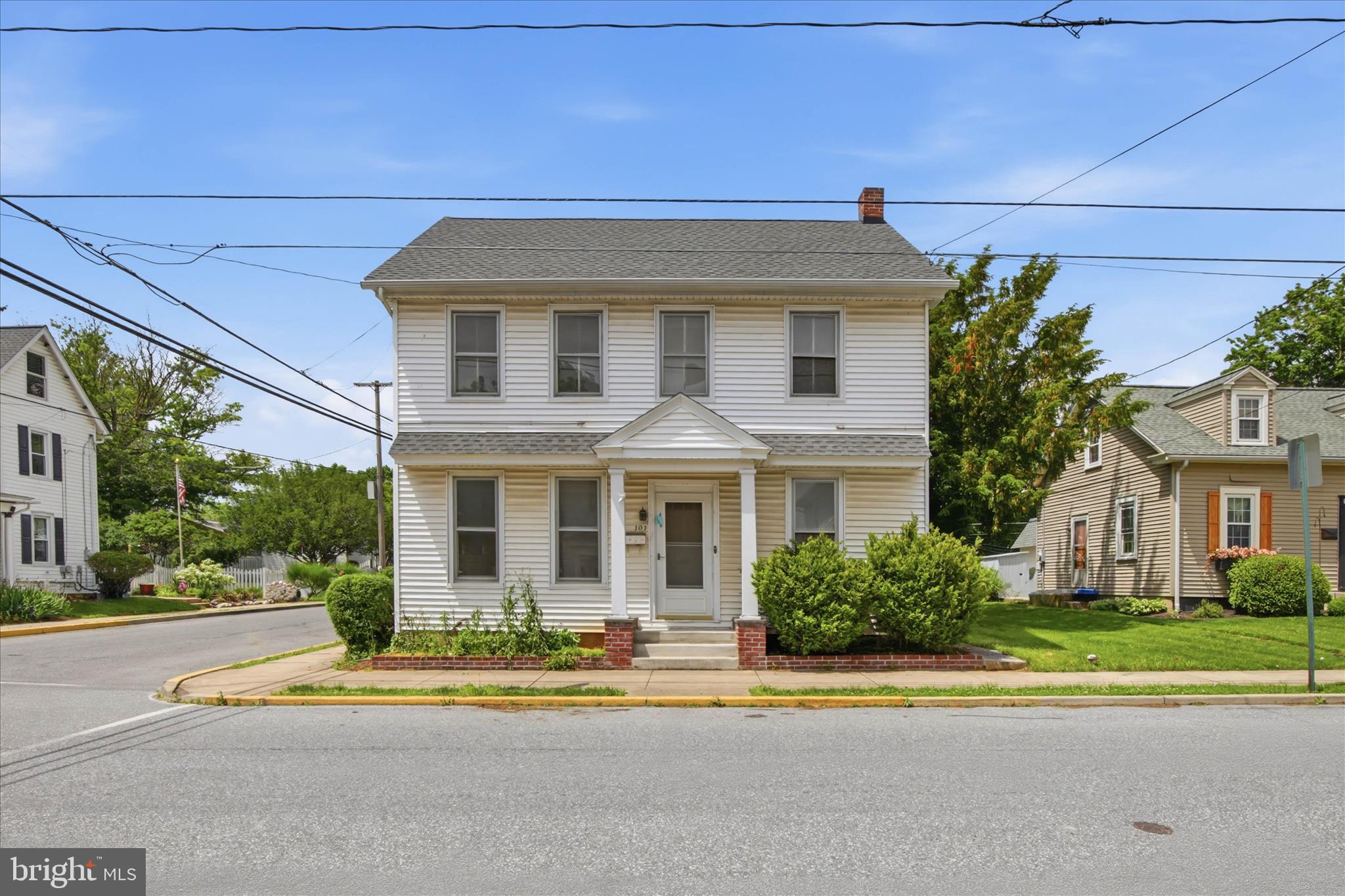 101 East Lincoln Avenue Lititz, PA 17543 - Photo 1 of 39 a front view of a house with a garden